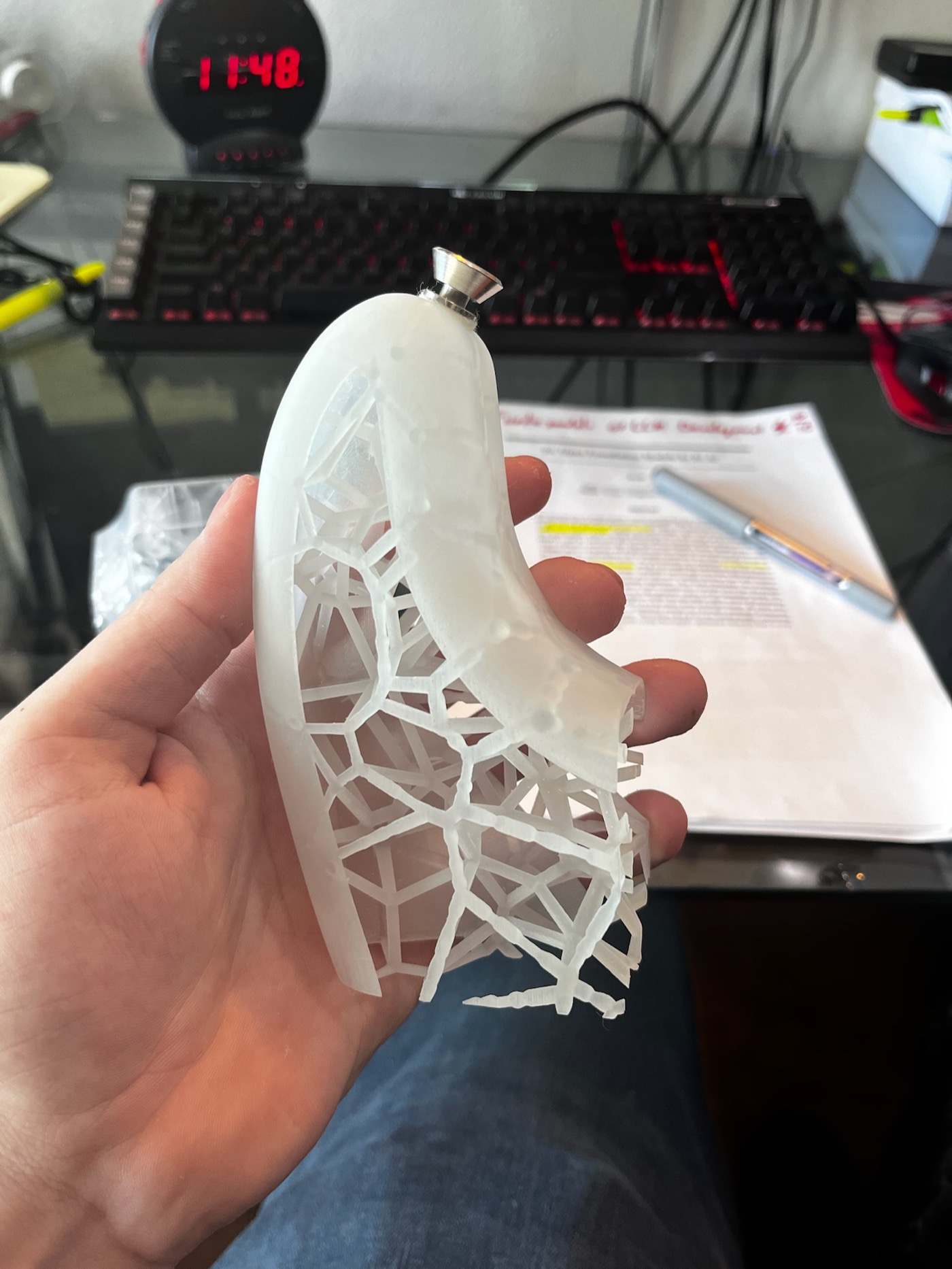 Hand-held resin body cutaway sample showing Voronoi lattice structure