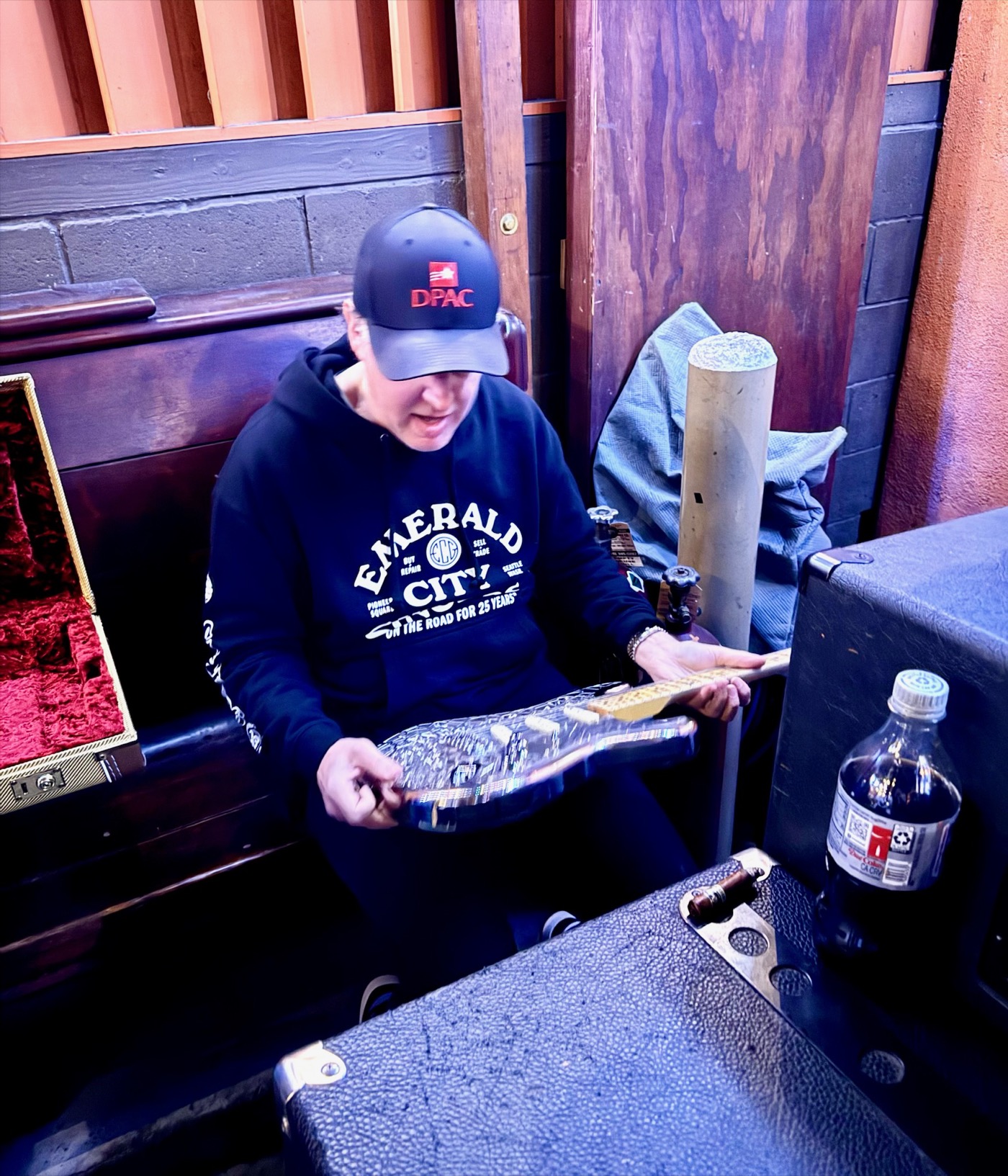 Joe Bonamassa examining the NASAcaster backstage, looking at the lattice detail