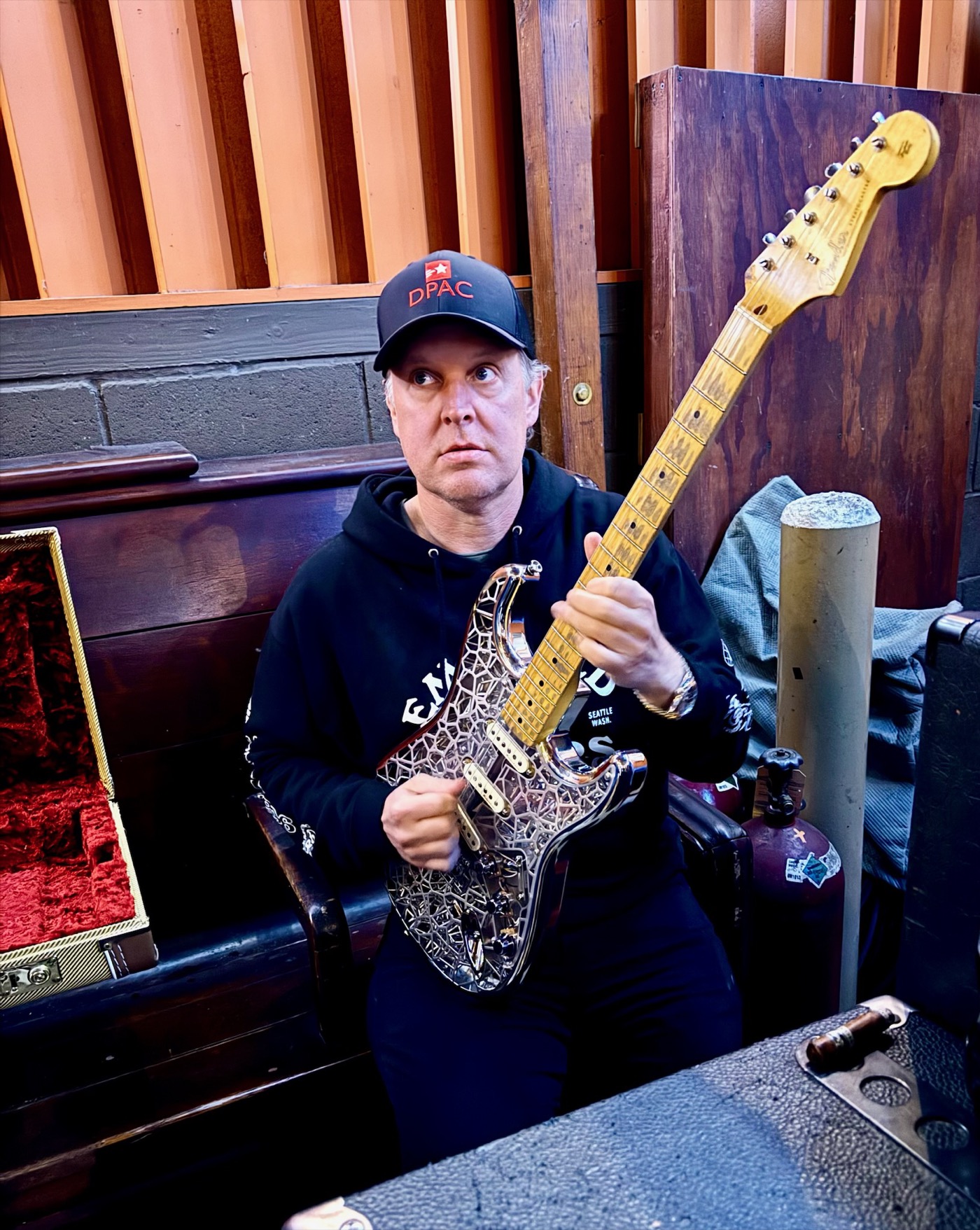 Joe Bonamassa holding the completed NASAcaster prototype backstage