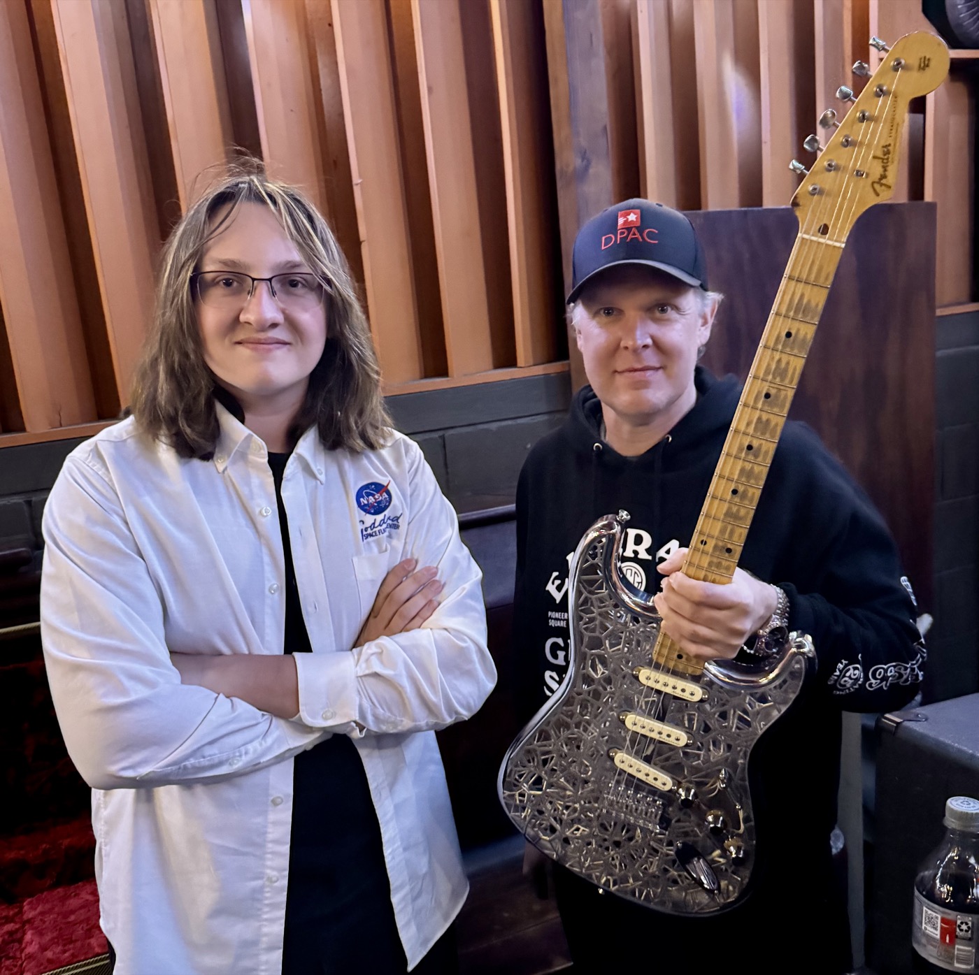 Marshall Doyle and collaborator posing backstage with the NASAcaster prototype